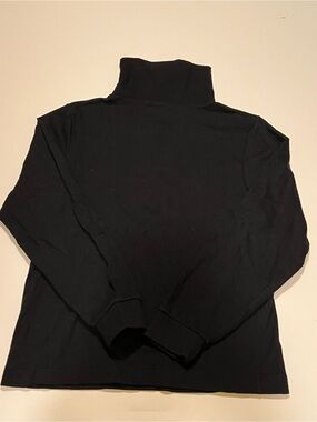 GIRL’S COPPER KEY BLACK TURTLENECK.